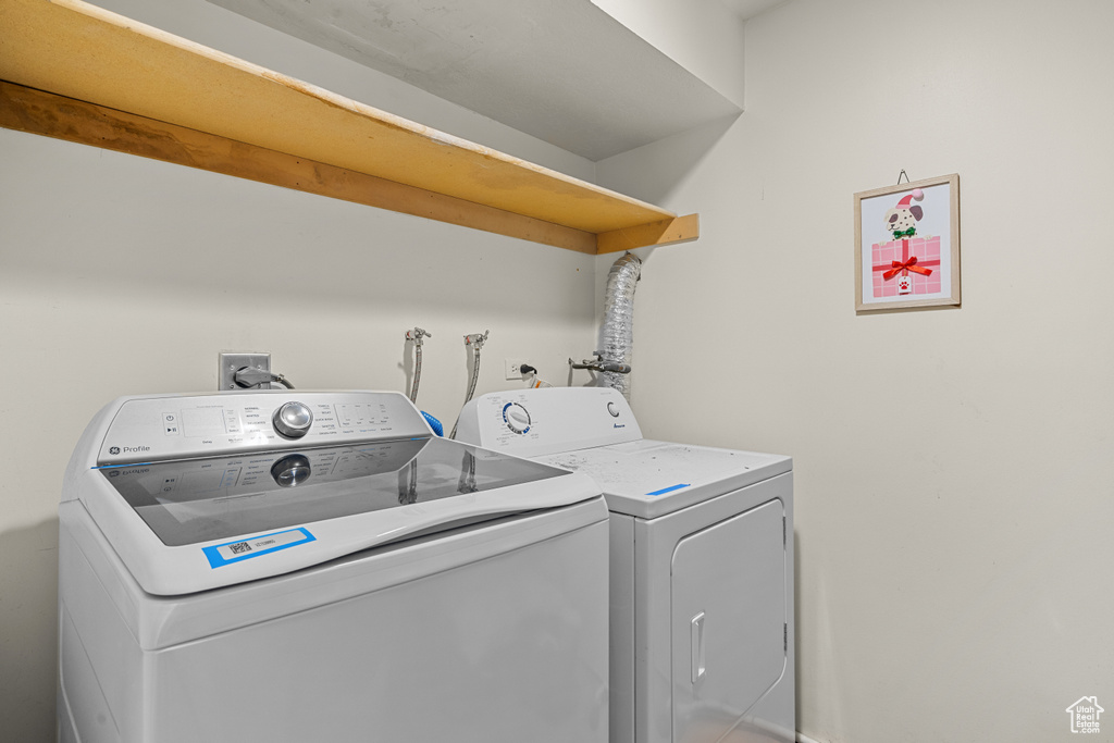 Laundry area featuring washing machine and clothes dryer