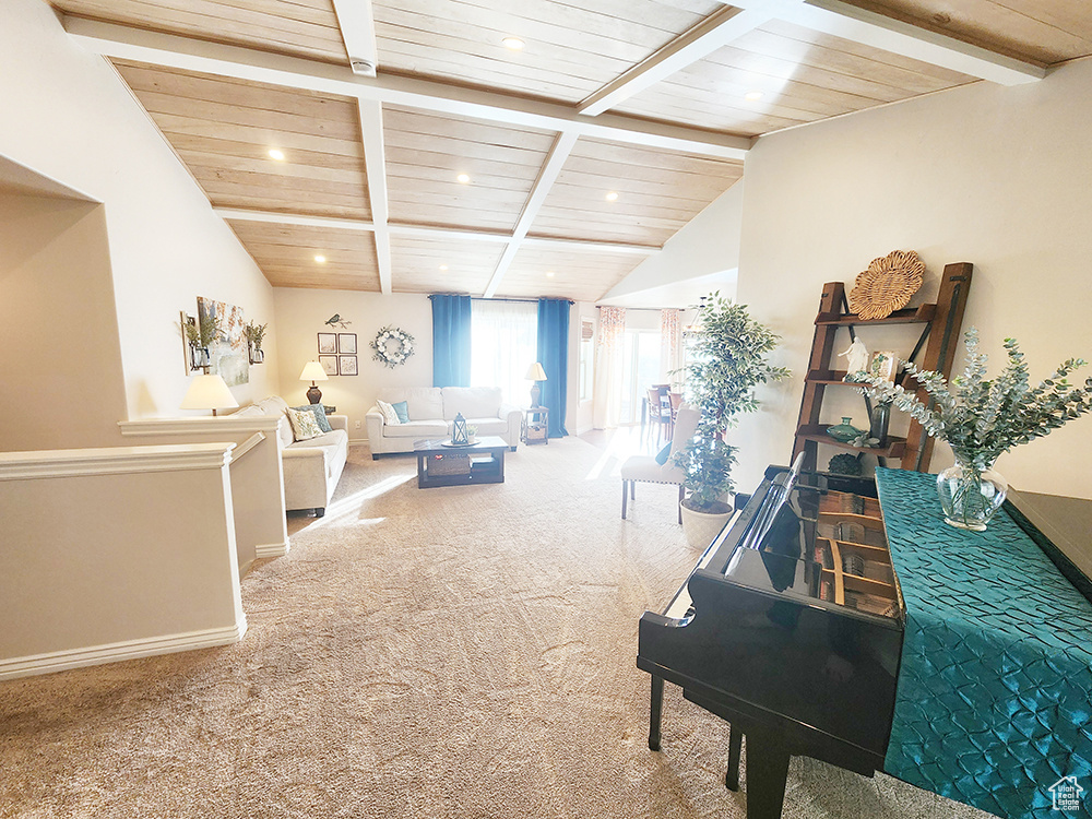 Living room with wood ceiling, carpet, and recessed lighting