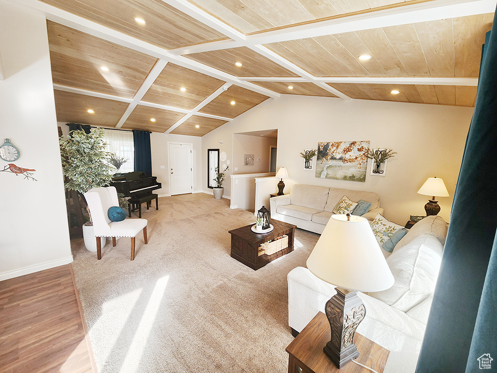 Living room featuring wooden ceiling, wood finished floors, and recessed lighting