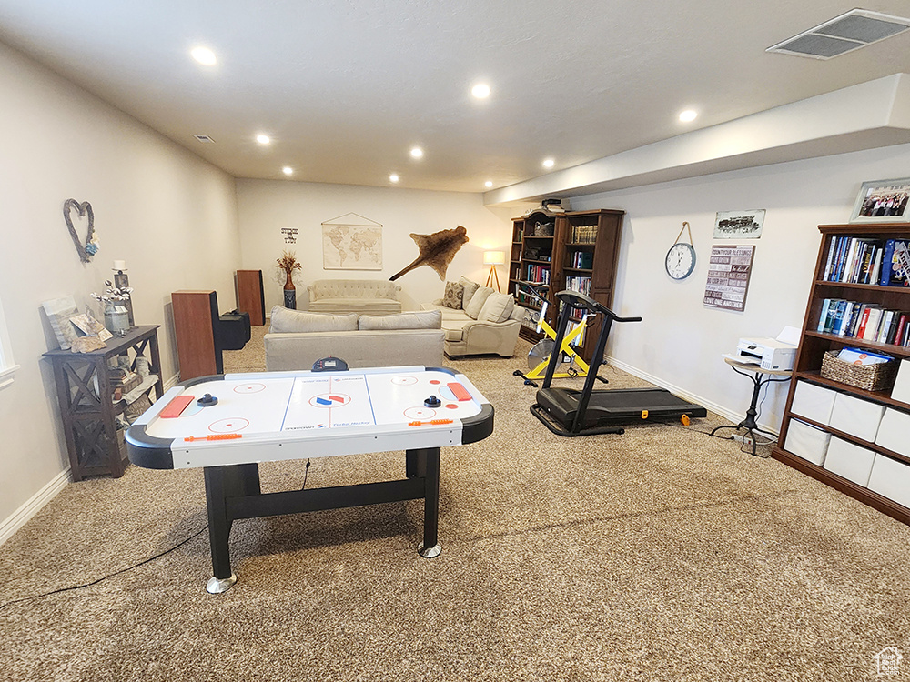 Recreation room with carpet flooring and recessed lighting