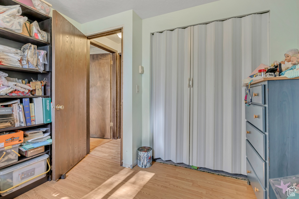 Bedroom with light wood finished floors