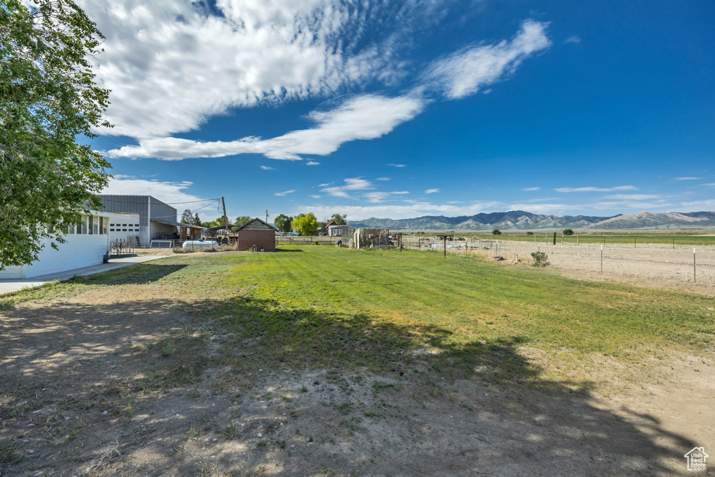 View of yard with a mountain view and a rural view