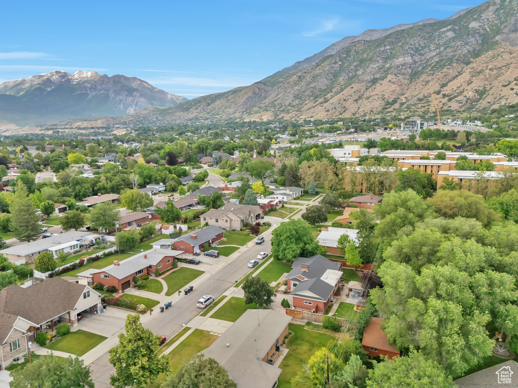 Aerial perspective of suburban area featuring a mountain backdrop