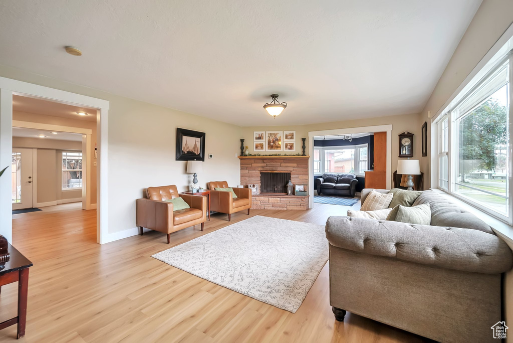 Living area featuring wood finished floors and a fireplace