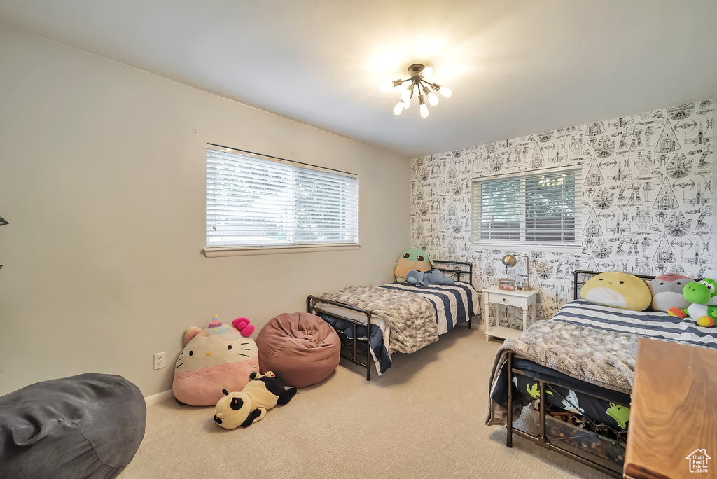 Bedroom featuring carpet flooring and wallpapered walls