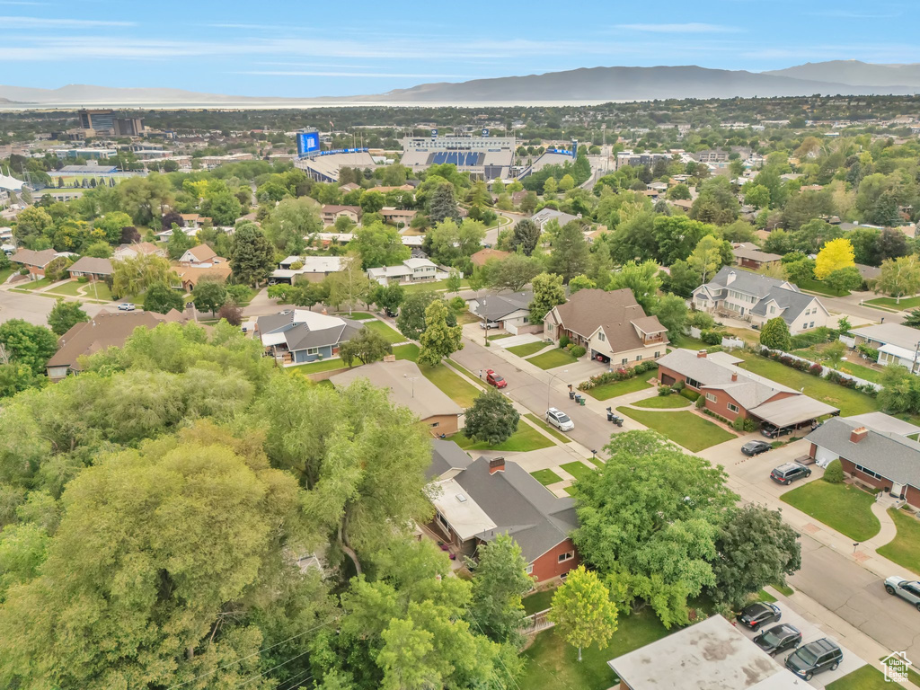 Aerial perspective of suburban area featuring a mountainous background