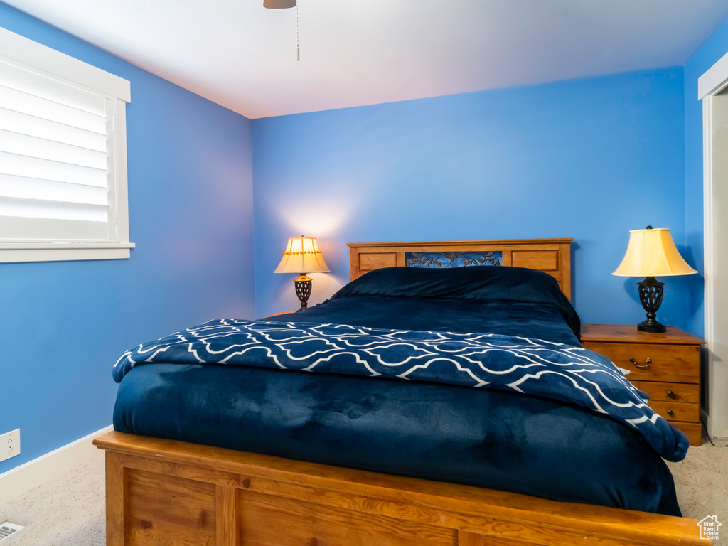 Bedroom featuring carpet and ceiling fan