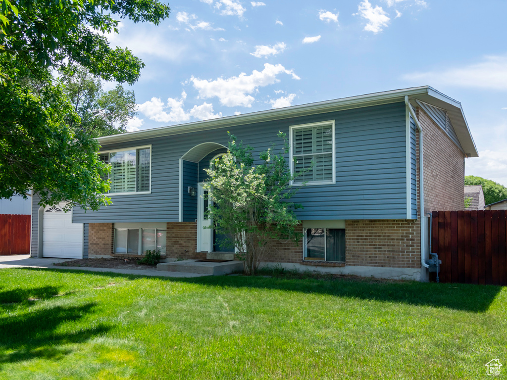 Bi-level home featuring brick siding