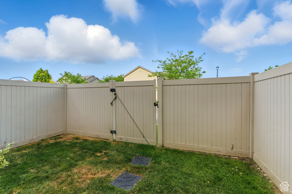View of yard featuring a gate