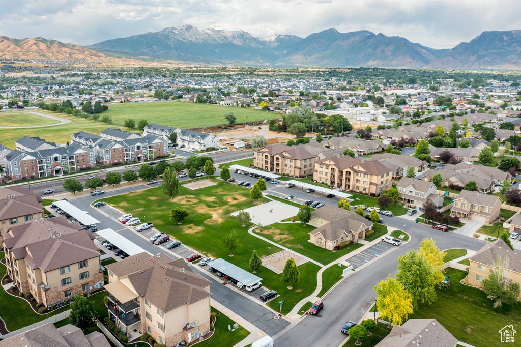 Aerial perspective of suburban area with a mountainous background