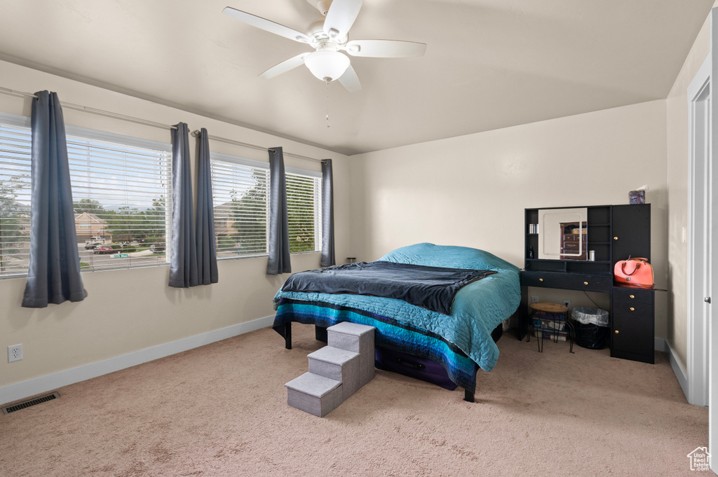 Bedroom with carpet floors and ceiling fan