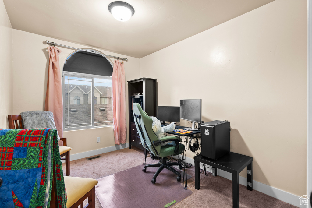 Carpeted office featuring baseboards