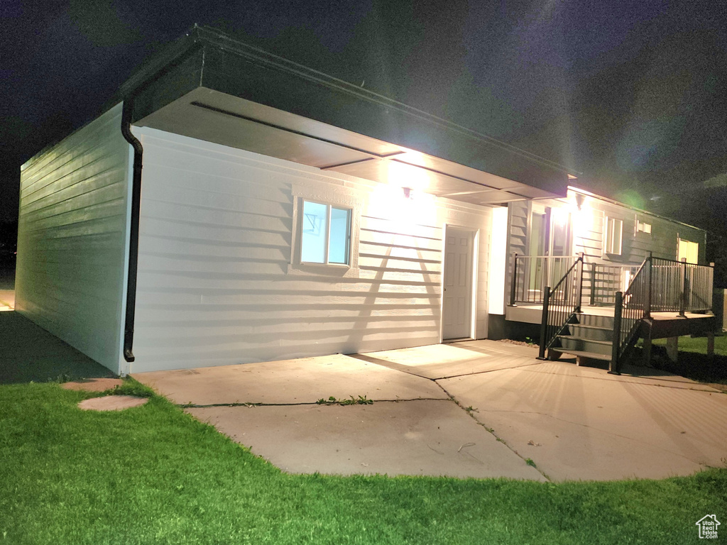 Exterior space featuring a patio area and a wooden deck