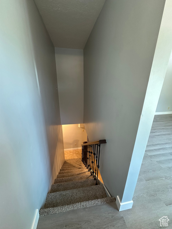 Stairs featuring baseboards