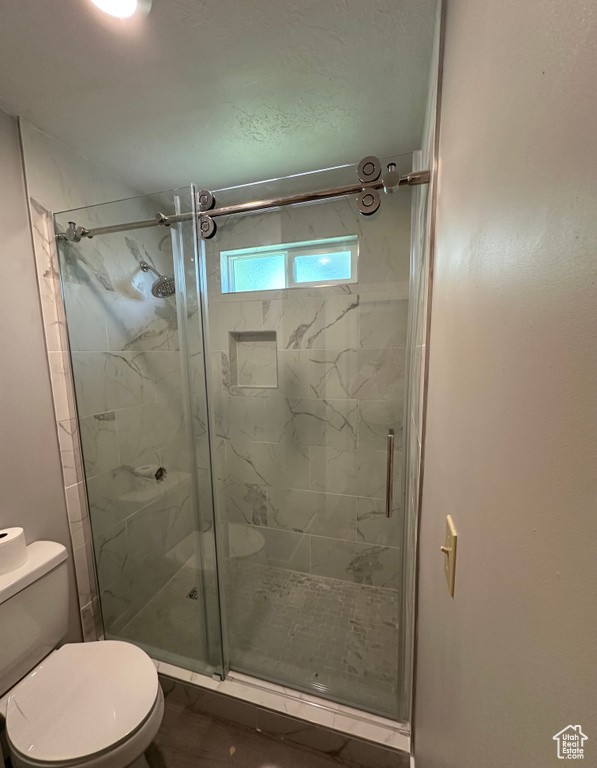 Full bathroom with a shower stall