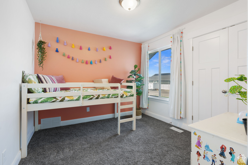Carpeted bedroom with baseboards
