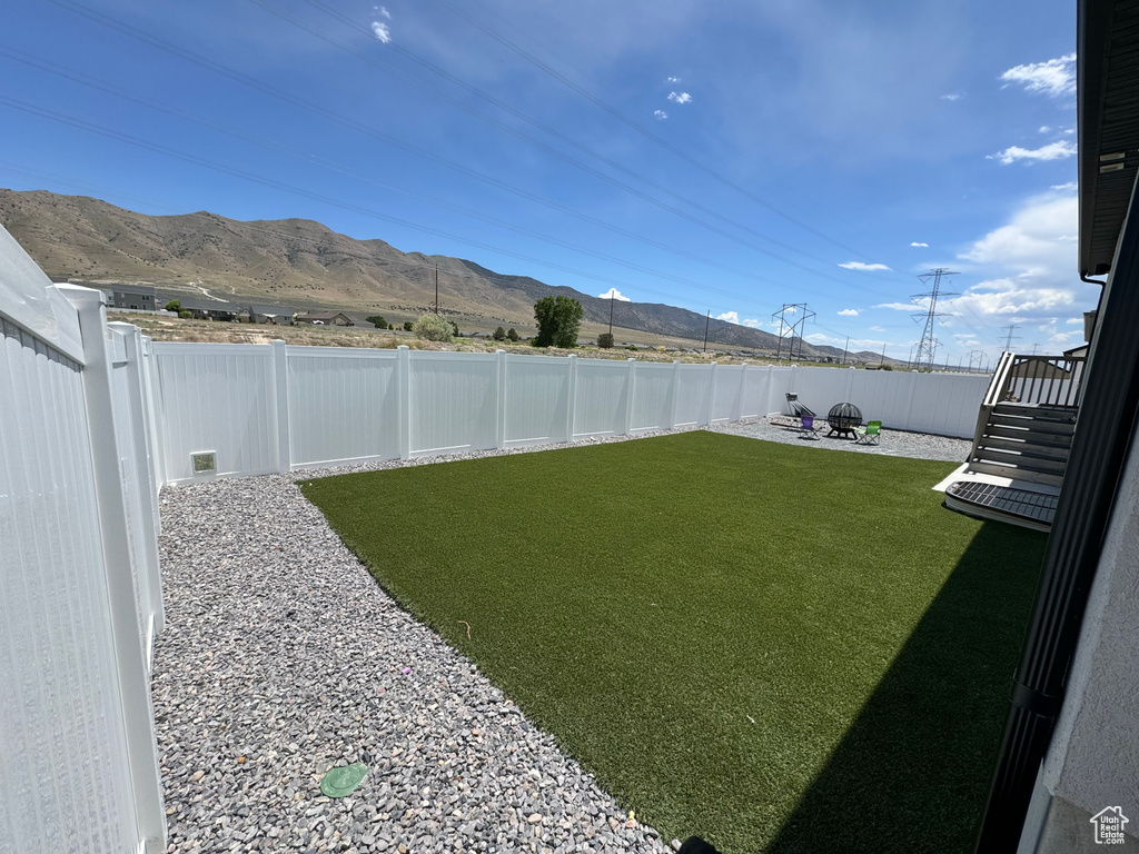 View of yard featuring a mountain view and a patio area