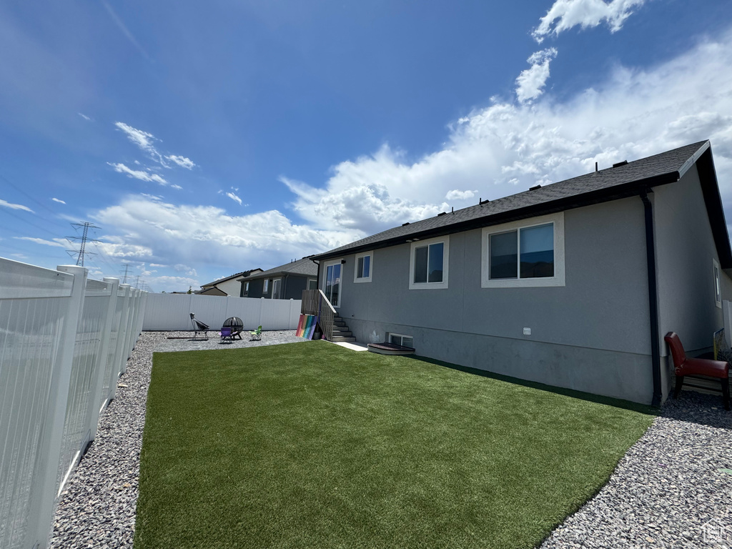 Back of house featuring a patio and entry steps