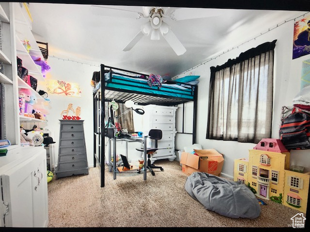 Bedroom with carpet and a ceiling fan