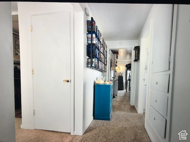 Hall featuring carpet flooring