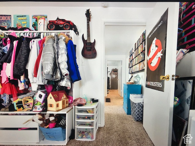 Walk in closet with carpet