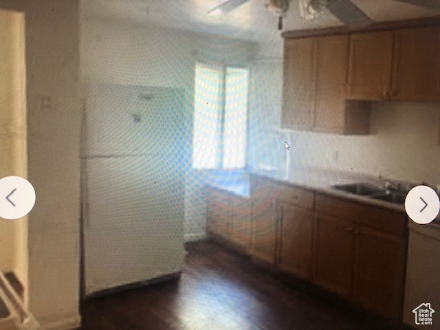 Kitchen with a ceiling fan and dark wood-style floors