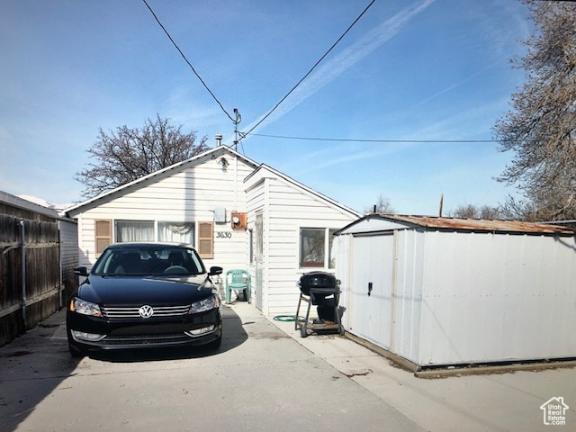 Garage featuring a shed