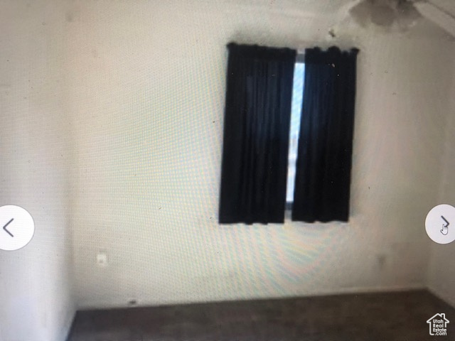 Unfurnished room featuring a ceiling fan