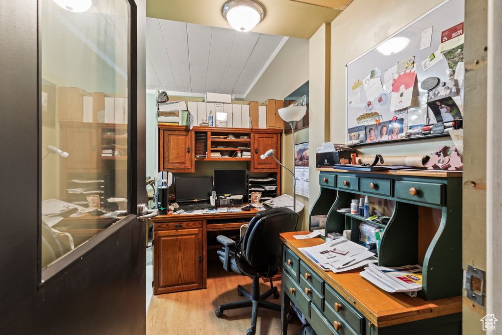 Office with light wood-style floors