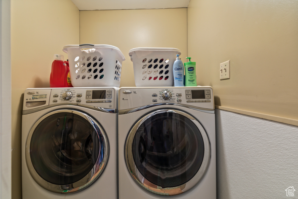 Laundry room featuring separate washer and dryer