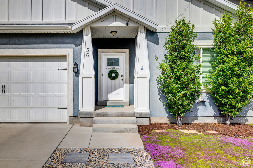 Doorway to property with board and batten siding