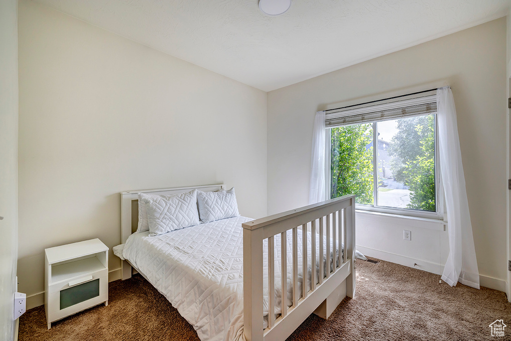 Carpeted bedroom with baseboards