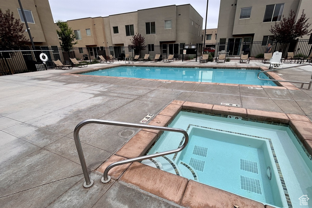 Community pool featuring a patio area