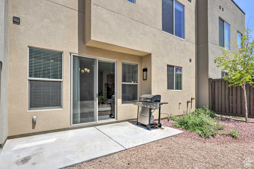 Rear view of property featuring stucco siding and a patio