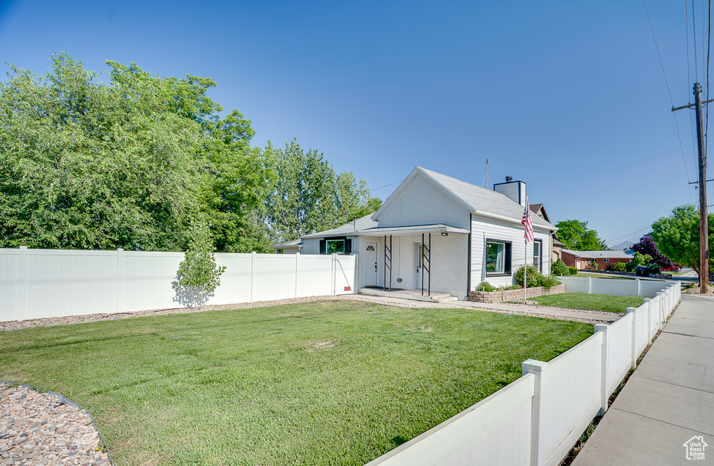 View of front of house featuring a fenced backyard