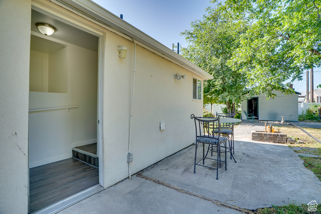View of patio / terrace featuring outdoor dining area and an outdoor structure