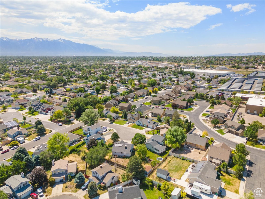 Aerial perspective of suburban area featuring a mountain backdrop