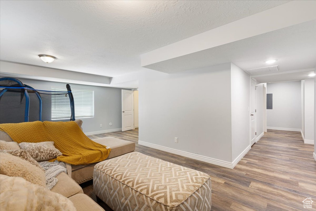 Living room featuring baseboards and wood finished floors