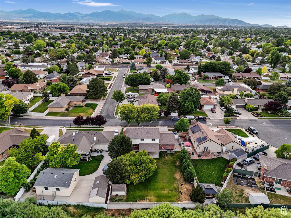 Aerial view of residential area featuring a mountainous background