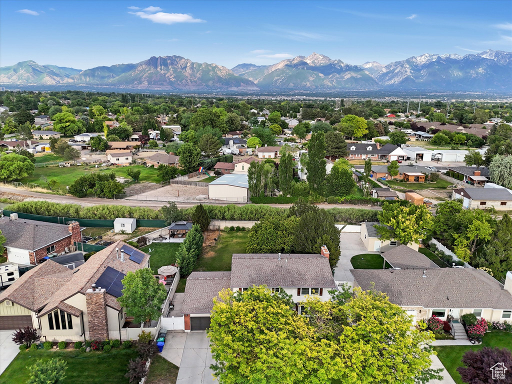 Aerial perspective of suburban area featuring a mountain backdrop