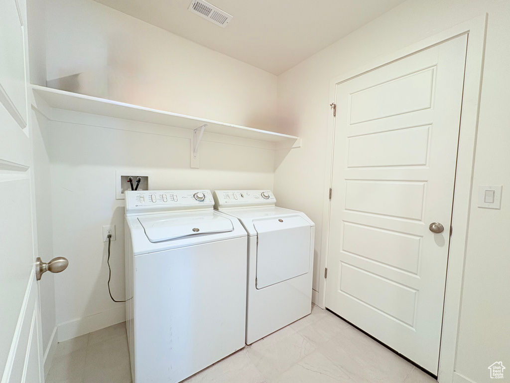 Laundry area featuring washing machine and dryer