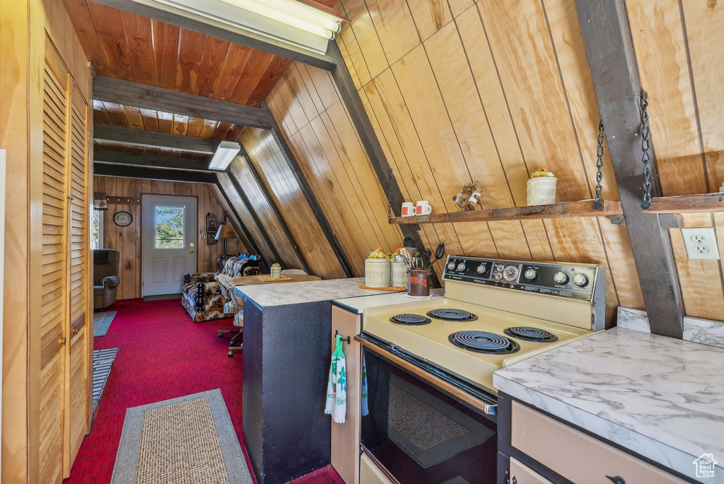 Kitchen with white electric range, carpet flooring, wooden walls, lofted ceiling, and wood ceiling