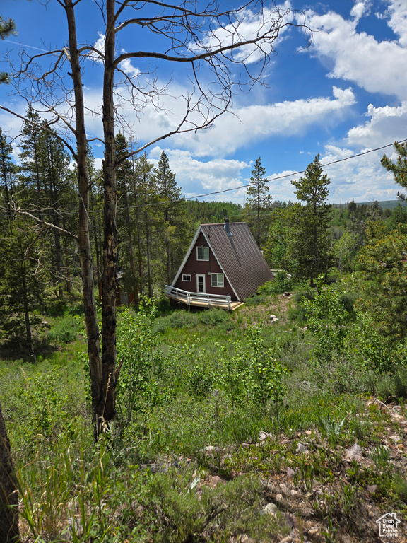 View of yard with a wooded view