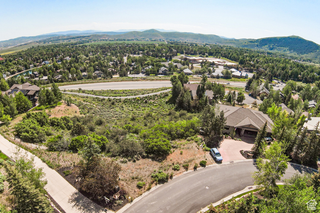 Aerial perspective of suburban area with a mountainous background