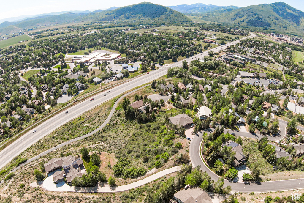 Aerial view of residential area featuring a mountain backdrop