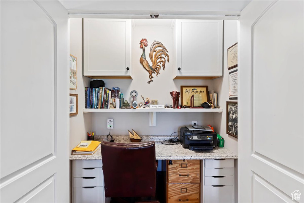 Office space featuring built in desk