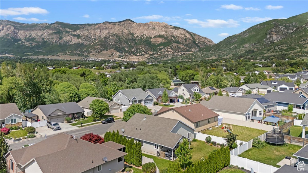 Aerial view of residential area featuring a mountainous background