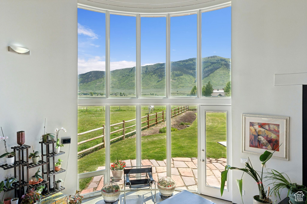 Sunroom featuring a mountain view and plenty of natural light