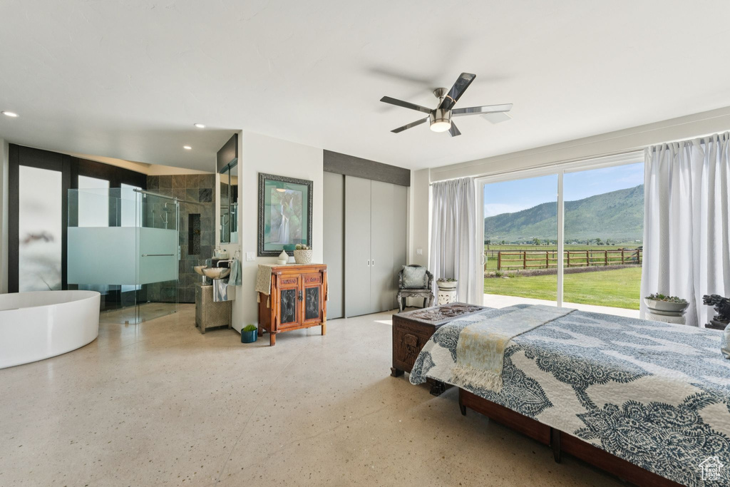 Bedroom featuring a mountain view, access to exterior, recessed lighting, a closet, and ceiling fan