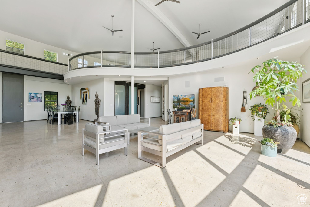View of patio with a balcony and an outdoor hangout area